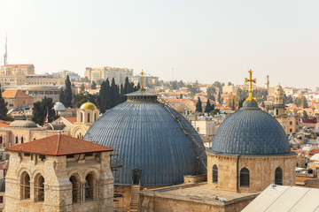 Obraz premium View from top on two domes and belfry of the Church of the Holy Sepulchre in Jerusalem