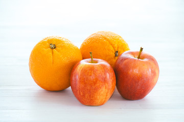 Apples and Oranges on a white background