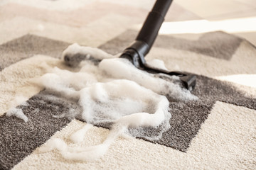 Washing of carpet with vacuum cleaner