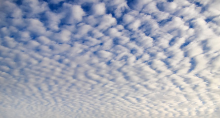 Blue sky with clouds as pattern
