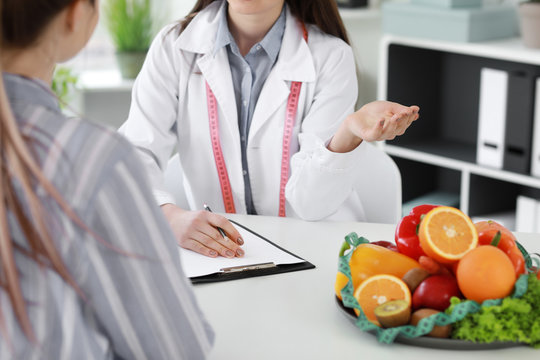 Young woman visiting nutritionist in weight loss clinic