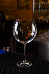 Expert barman is making cocktail at night club, Barman holds a cocktail in his hand. No face. Selective focus