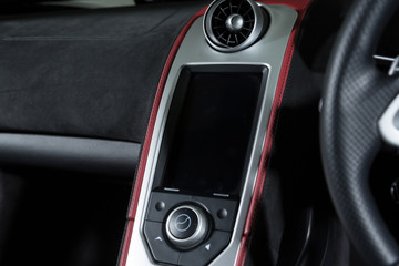 Fototapeta na wymiar Close up of touch screen in sports car interior