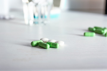 Pills on white table