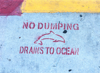 No Dumping Drains To Ocean writing on the sidewalk in Key West