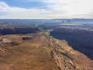Fototapeta na wymiar Mesa and canyon landscape aerial view near Arches National Park, Moab, Utah, USA.