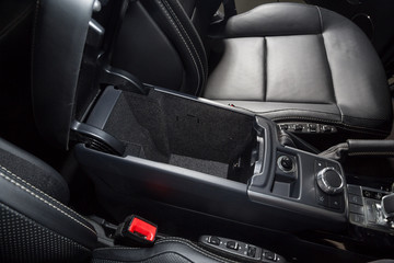 Storage compartment in black car interior