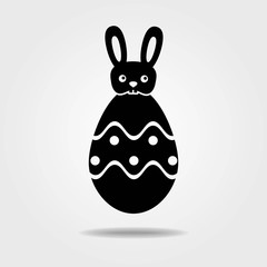 Easter egg with bunny icon isolated on white background.