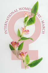 top view of pink alstroemeria flowers and green leaves on white background with international womens day illustration