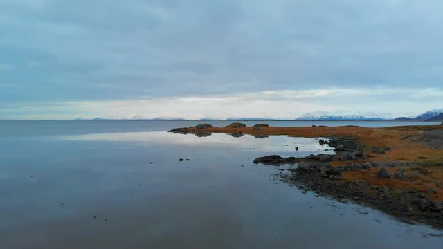 Aerial shot of water and land in Iceland