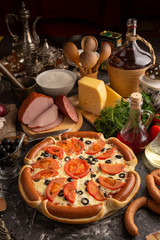 Pizza with edging of sausages