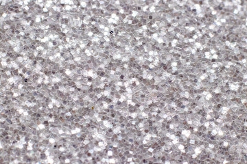 Silver glitter texture. Festive sparkling sequins background. Wpaper for Valentine, New Year or Christmas Holidays
