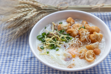 Breakfase meal. Congee or Rice porridge minced pork, boiled egg with soy milk and Chinese deep fried double dough stick