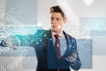 confident businessman in suit pointing with hands at network illustration in front