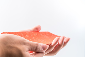 Man's hand holding with Chinese red envelope (red packet). Chinese new year concept.