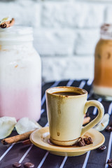 Obraz na płótnie Canvas Espresso cup on the background of coffee machines, black coffee morning on coffee maker