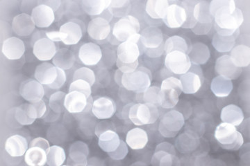 Silver glitter festive background with bokeh lights. Celebration concept for Holidays and anniversary.