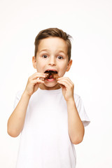 little beautiful boy holding chocolates studio shot 