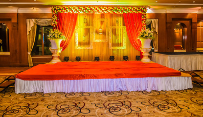 Beautiful Indian wedding ceremony stage set in colors and entran