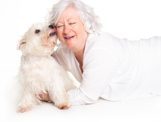 A Elderly woman with her Westie dog