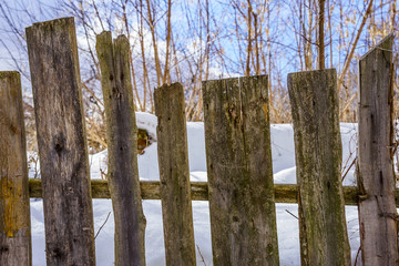 old fence around the garden of nailing boards