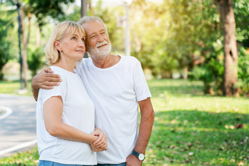 Senior Caucasian Women and men Standing in garden during summer Which is lover who has been caring for long time Take care of health And travel together in retirement Concepcion insured the elderly