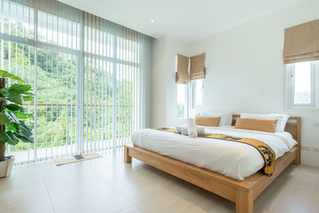 Luxury Interior design in bedroom of pool villa with cozy king bed. Bedroom with high raised ceiling  home, house ,building