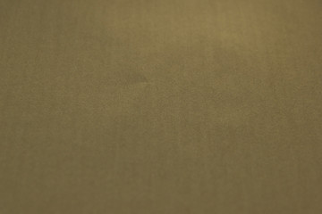Beautiful light brown paper background. Empty space concept. Light brown paper texture background. Colored cardboard fibers and grain.
