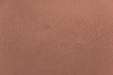 Beautiful coral paper background. Empty space concept. Coral paper texture background. Colored cardboard fibers and grain.