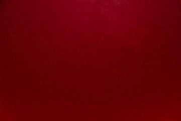 Beautiful red paper background. Empty space concept.Red paper texture background. Colored cardboard fibers and grain.
