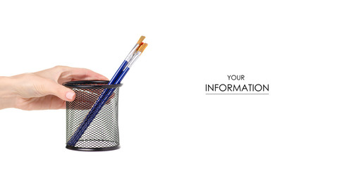 Paint brushes in a glass in hand pattern on a white background. Isolation