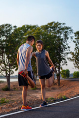 Obraz premium Running at sunrise couple exercising for marathon and workout .fitness, sport, people and lifestyle concept - Happy couples exercising with outdoor running