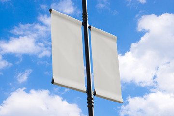 3D rendering of blank flag banner (empty advertisement) with clouds. Empty mockup template