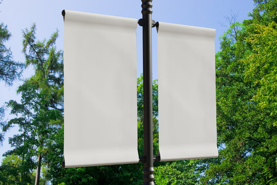 3D rendering of blank flag banner (empty advertisement) with clouds. Empty mockup template