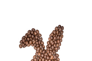 Easter holiday background with bunny ears made of freshly roasted coffee beans on a white background. Creative easter concept. Copy space.