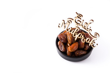 Dates and Eid Mubarak message isolated on white background. Copyspace