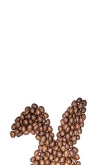 Easter holiday background with bunny ears made of freshly roasted coffee beans on a white background. Creative easter concept. Copy space.