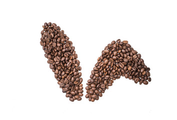 Easter holiday background with bunny ears made of freshly roasted coffee beans on a white background. Creative easter concept. Copy space.