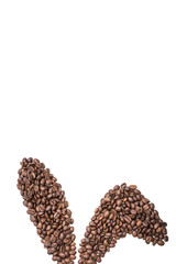 Easter holiday background with bunny ears made of freshly roasted coffee beans on a white background. Creative easter concept. Copy space.