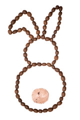 Easter bunny made of freshly roasted coffee beans and ice cream ball on a white background. Creative easter concept.