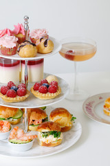 Afternoon tea with mini brioche canapes and selection of sweets