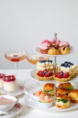 Fototapeta premium Afternoon tea with mini brioche canapes and selection of sweets