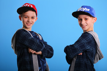 portrait of twins on blue background 