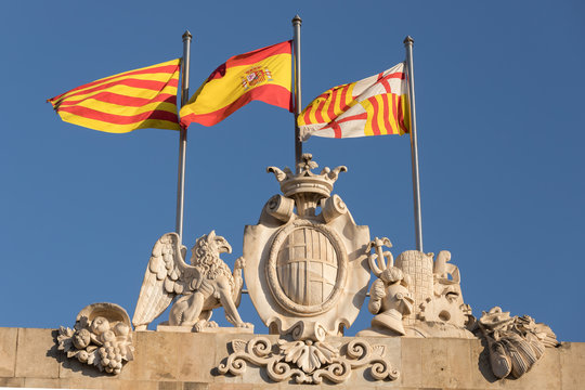 the flags of catalonia, spain and barcelona in the wind