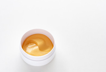 Gold energy hydrogel eye patch. Moisturizing the skin. Top view with copy space.
