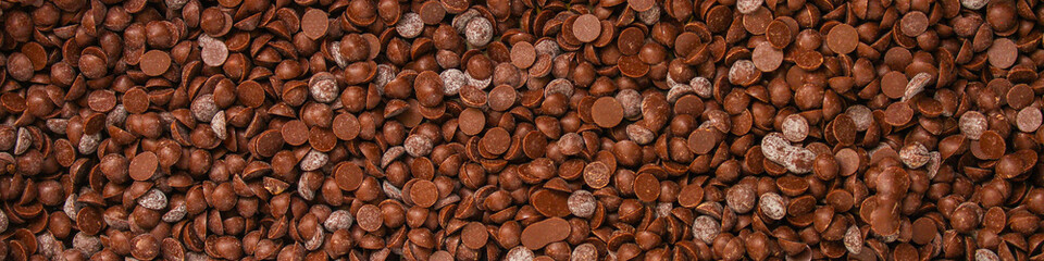 chocolate drops (sweets). food background. copy space. top