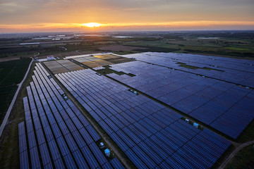 Aerial solar photovoltaic panel base at sunrise