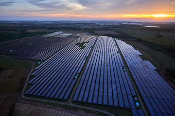 Aerial solar photovoltaic panel base at sunrise