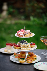 Afternoon tea with mini brioche canapes and selection of sweets