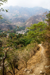 Path to the valley of the village Jaibalito along lake Atitlan with misty mountains, Guatemala